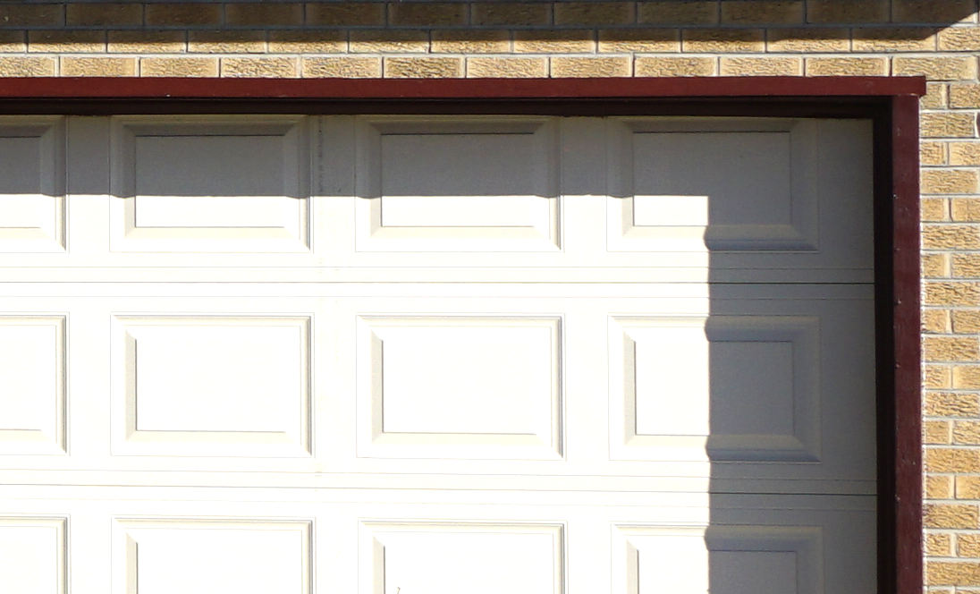 Here’s a close-up of the garage door - notice how the trim has some ding and places where the paint is missing.